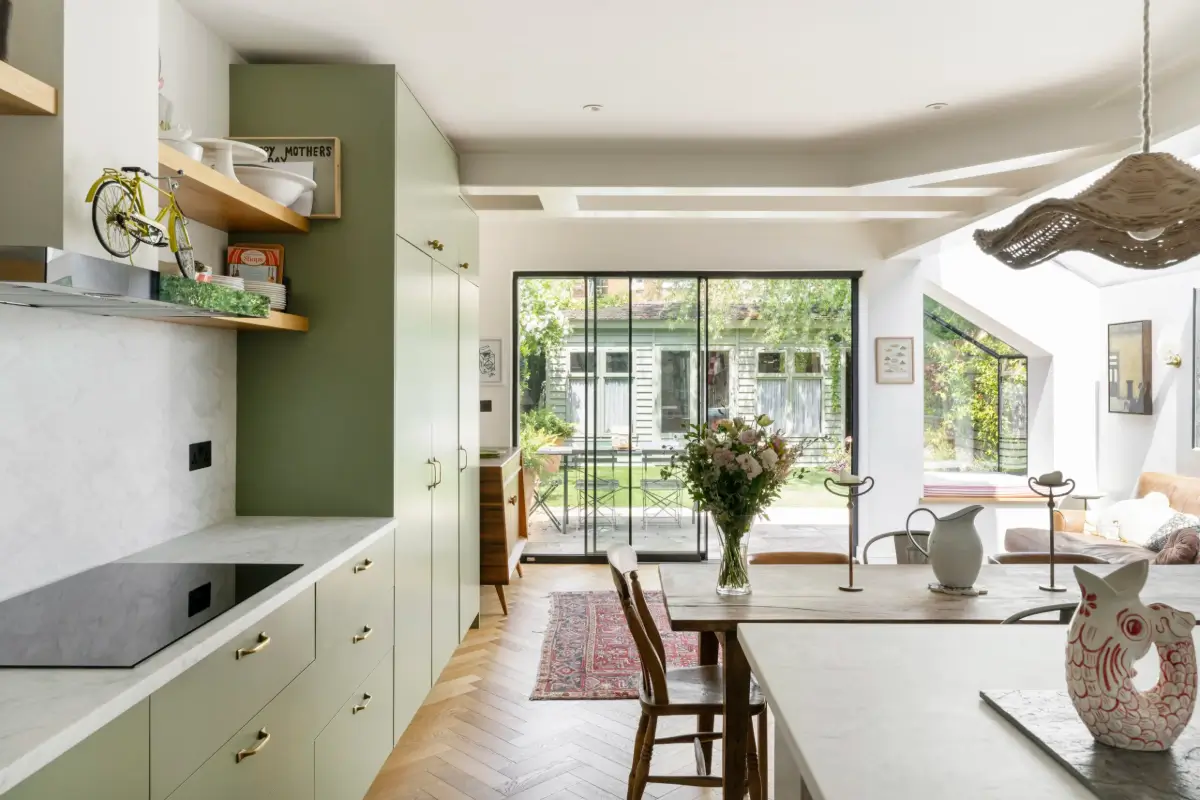 A Beautiful Extended Victorian House in Queen's Park 6 kitchen extension modern green cabinets herringbone parquet floor