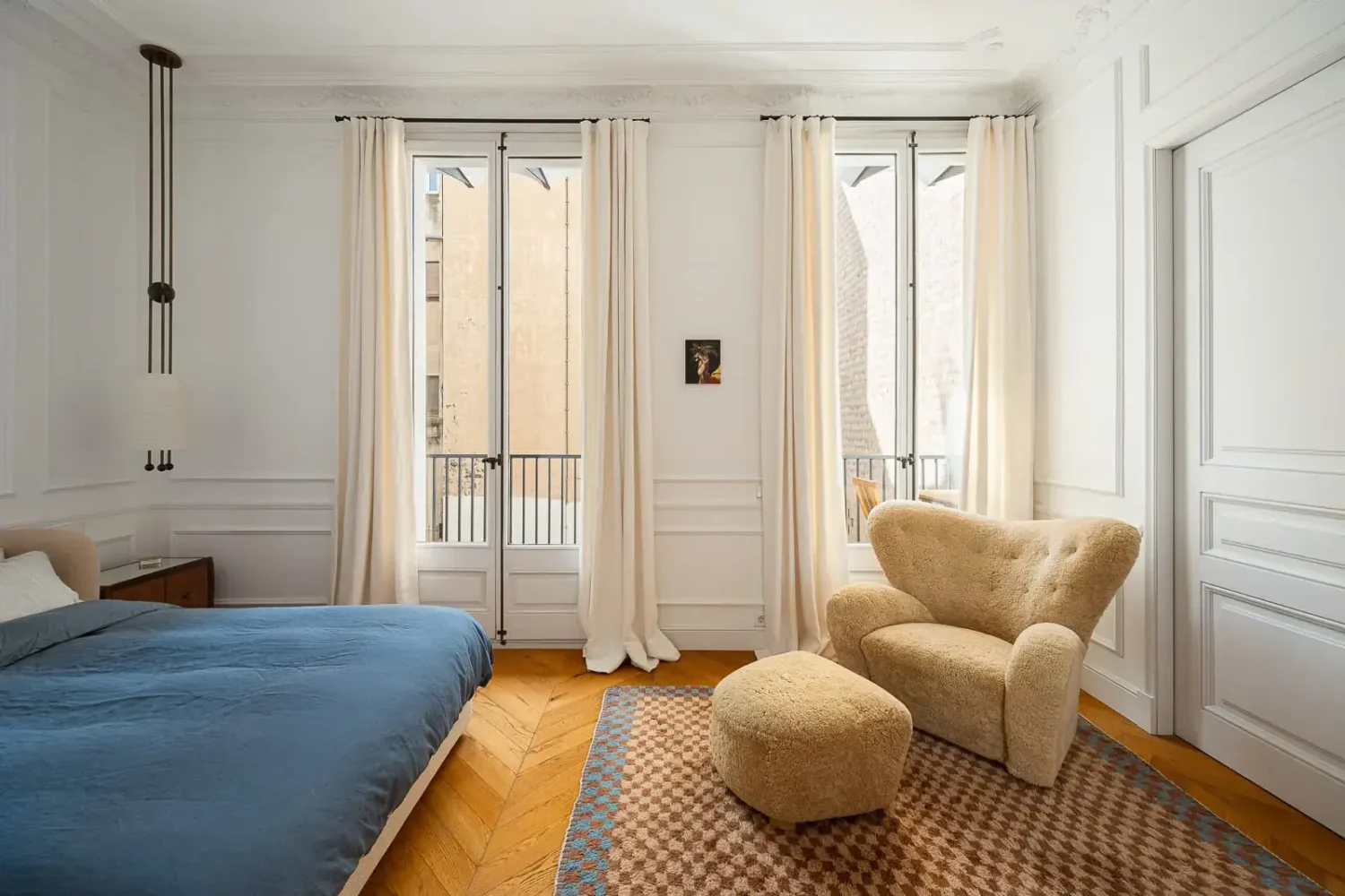 Contemporary Design in a Renovated Barcelona Apartment 7 large bedroom wooden chevrown floor large rug