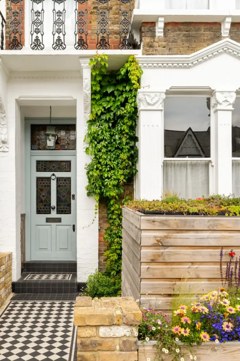 light blue front door checkered path
