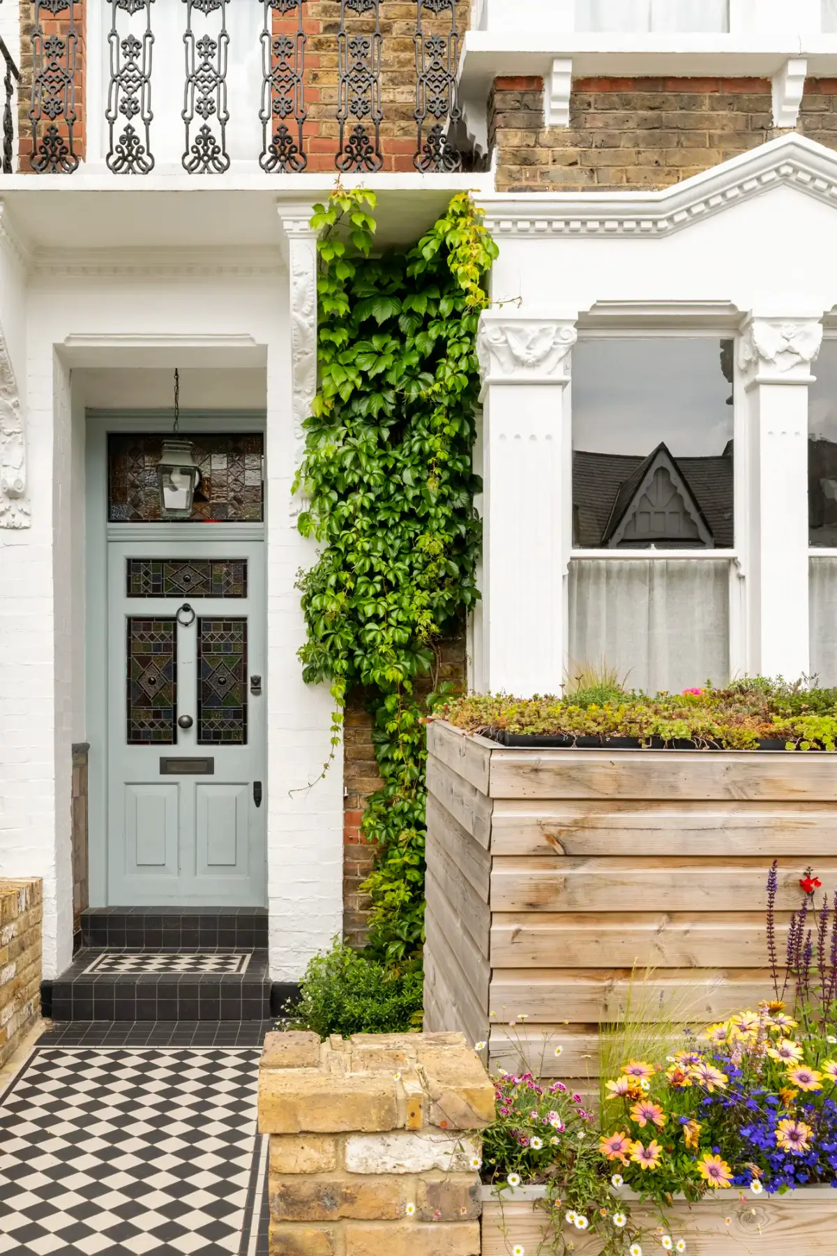 light blue front door checkered path
