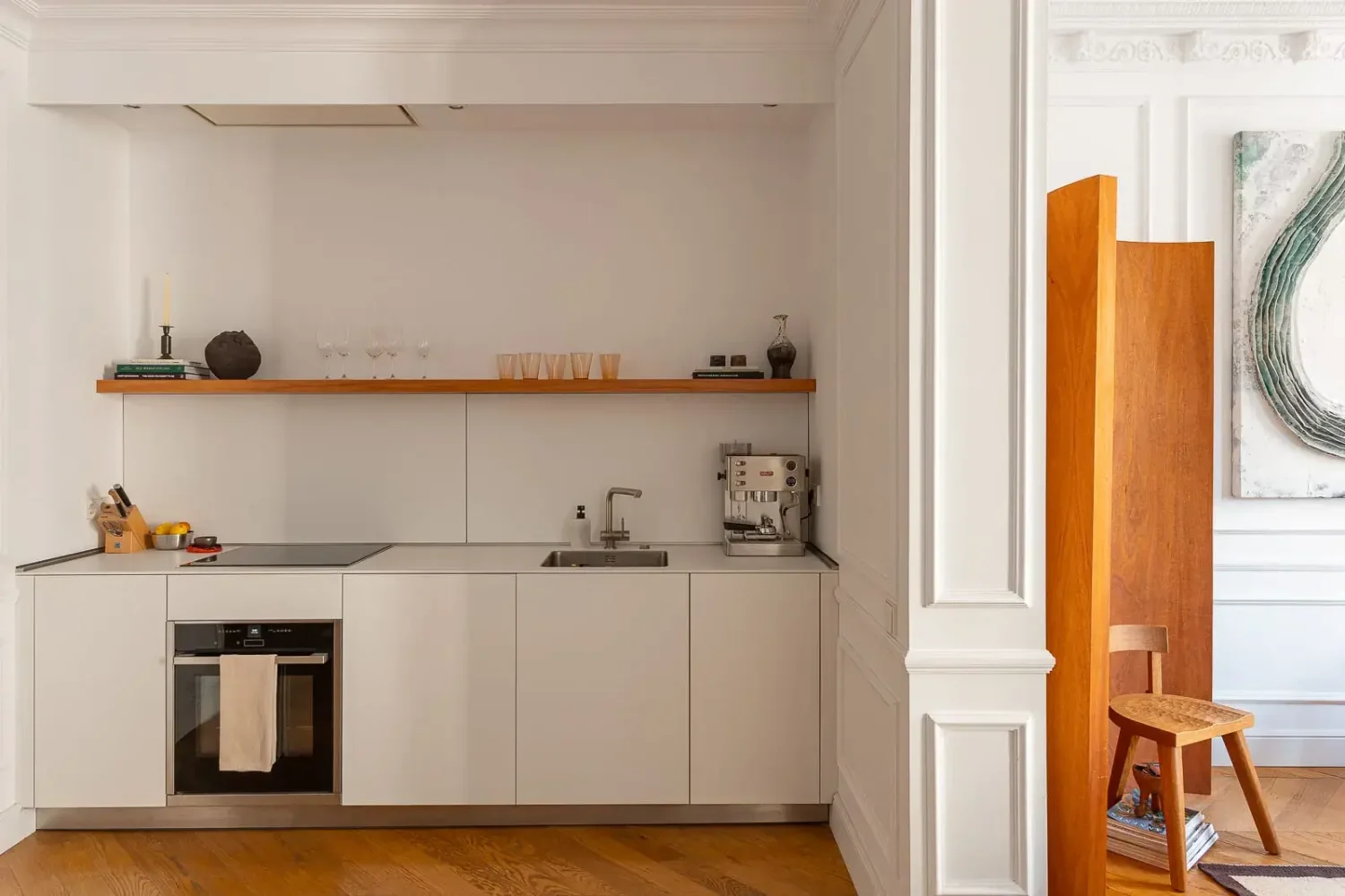 Contemporary Design in a Renovated Barcelona Apartment 4 modern white kitchen with shelf
