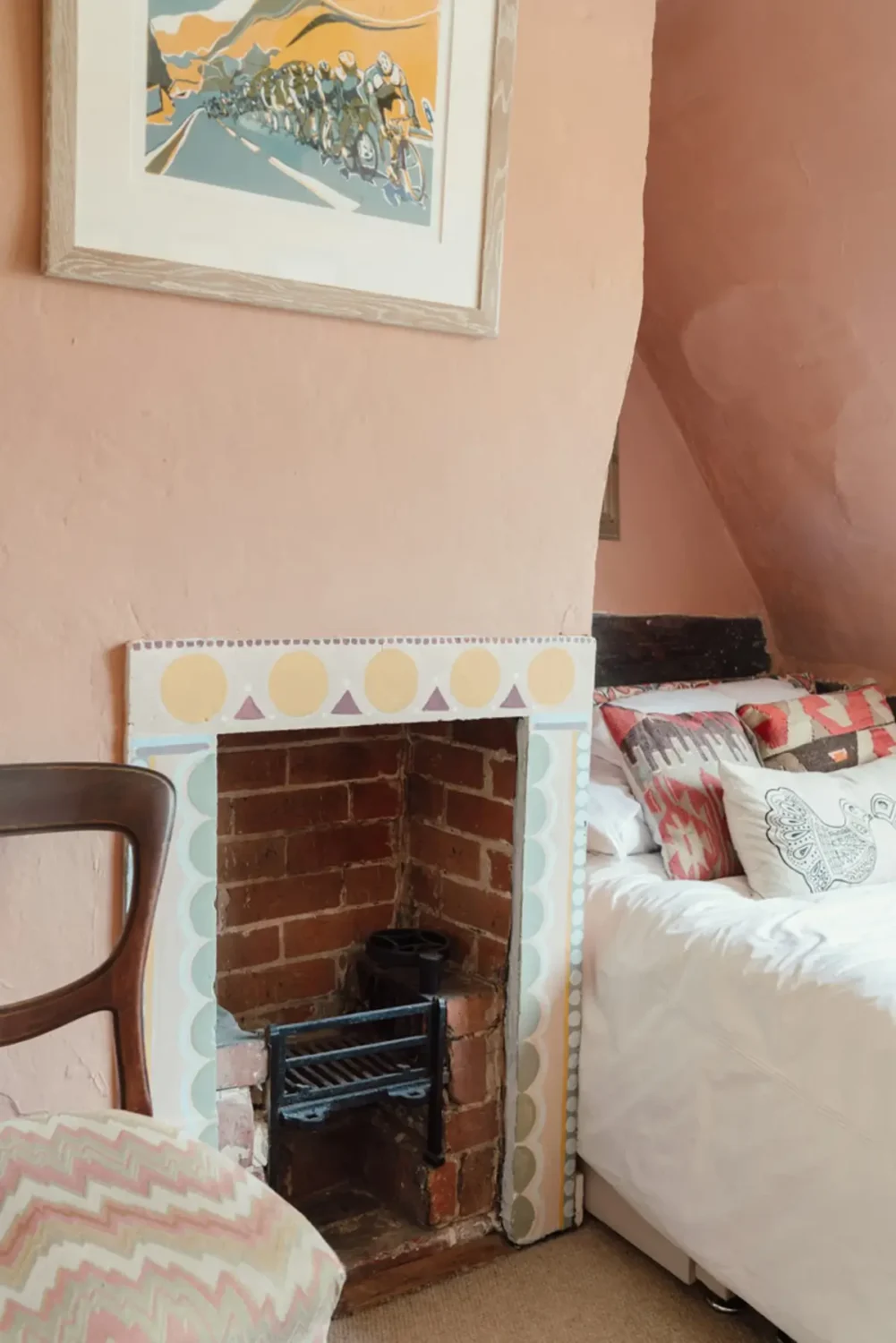 A Historic English Cottage Decorated in Pink & Blue Tones 18 pink walls painted fireplace mantel english cottage