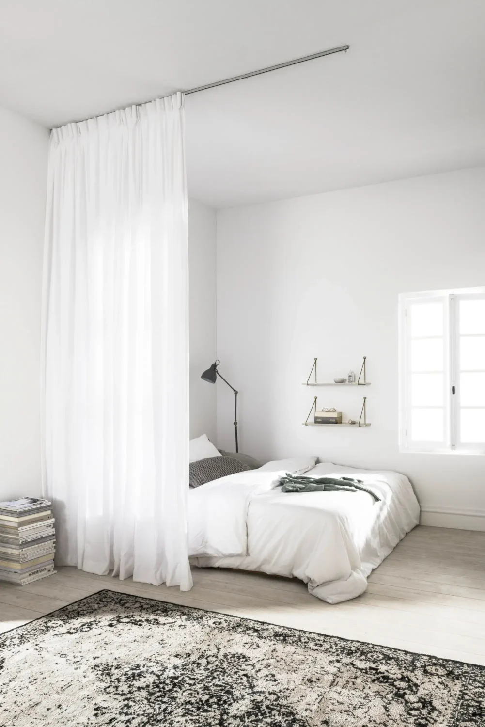 52 Studio Apartments with a Curtain Room Divider 53 simple-curtain-grey-white-studio-apartment-nordroom