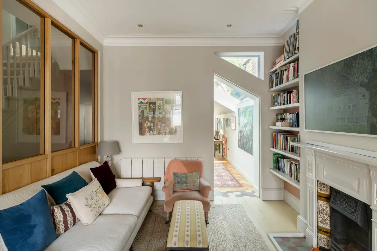 A Beautiful Extended Victorian House in Queen's Park 3 sitting room fireplace bookshelves