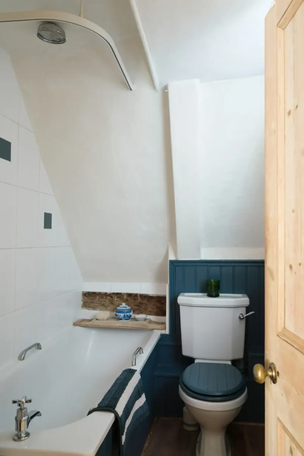 A Historic English Cottage Decorated in Pink & Blue Tones 20 small bathroom blue paneling