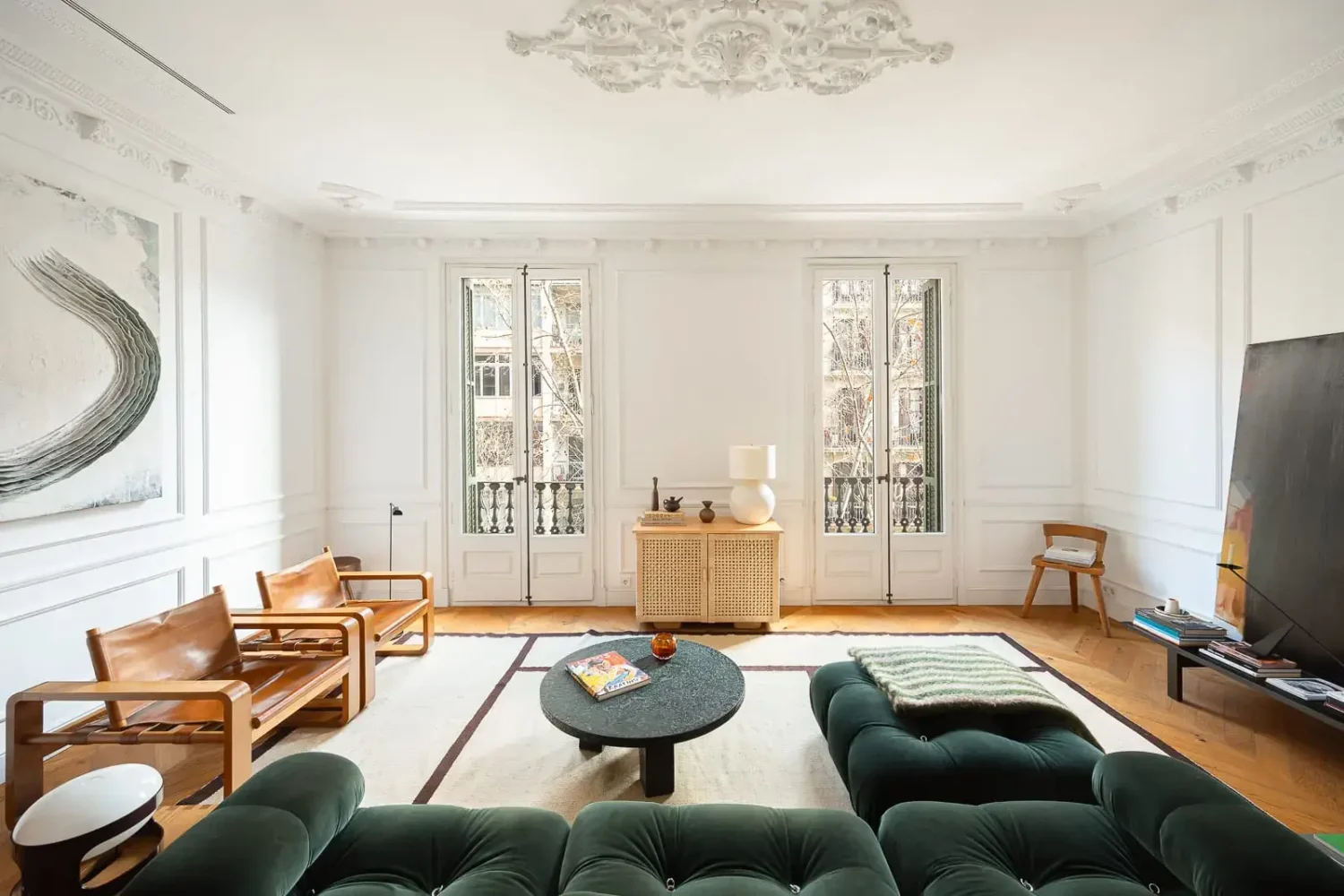 Contemporary Design in a Renovated Barcelona Apartment 2 spacious living room period features large green sofa