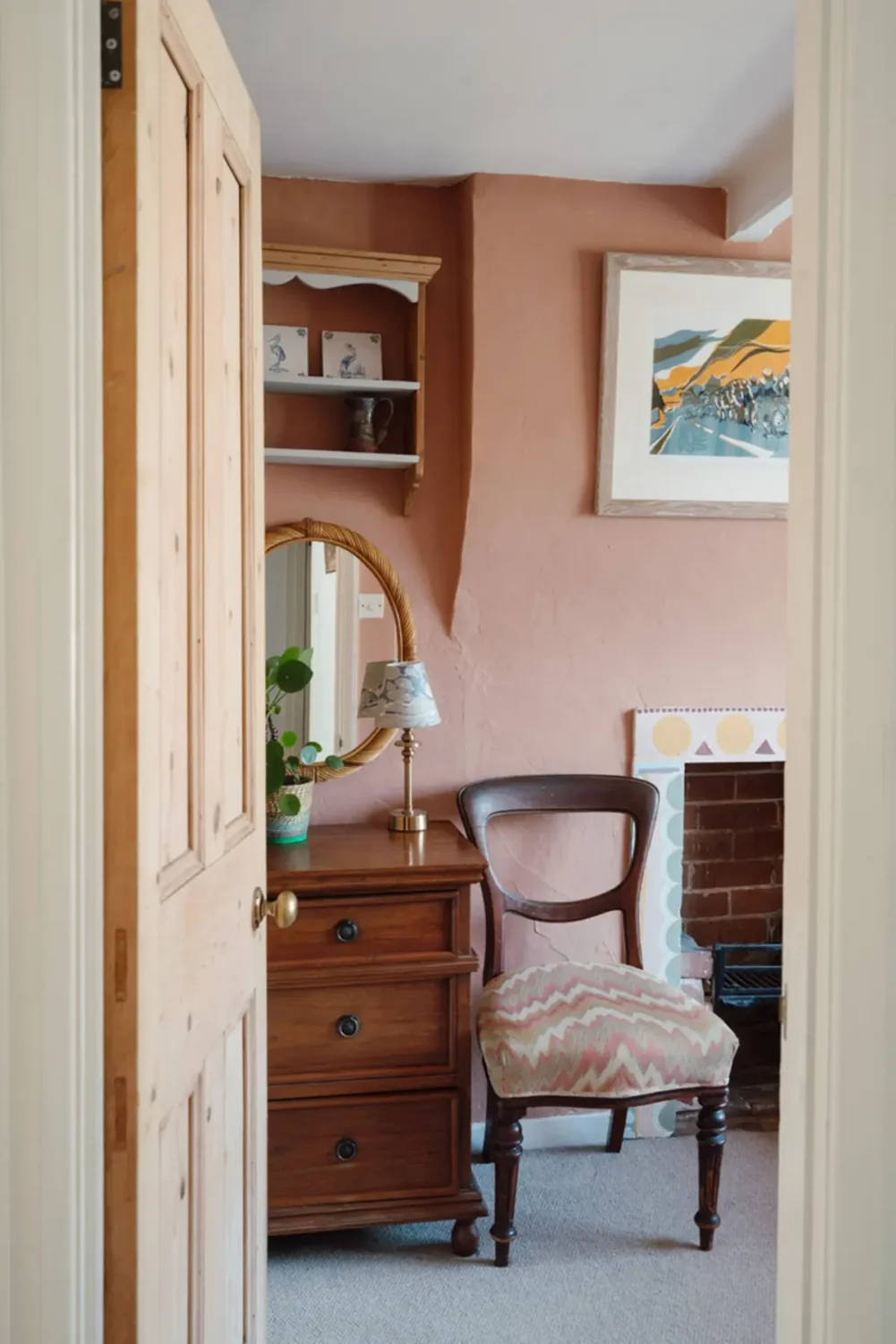 A Historic English Cottage Decorated in Pink & Blue Tones 16 view into pink bedroom
